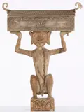 Indonesia by Dayak Reliquary Figure, sculpture of a crouching figure holding a long building above his head, sold Jun 2023