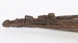 Papua New Guinea by Alligator Form Wood Boat Bow, carved wood in the form of an alligator and various other forms, sold Jun 2023