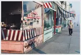 Main Barber from Sidewalk by Fred Herzog, archival pigment print, sold May 2026