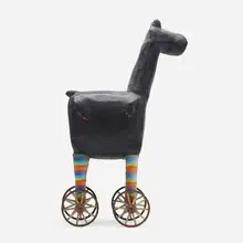 Beastie with wheels by Dennis Pearson, 1986, lacquered fiberglass, painted wood, enameled steel, textile, rubber, sold May 2023