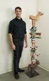 Hand-painted, glazed ceramic and by Molly Heizer, mixed media elements "Kachina's" stacked onto metal pole welded to steel base, offered Jan 2024
