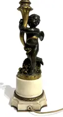 (sculpteur) - Susse frères (éditeur) Flambeau figurant un putto ailé au panier de fruits renversé à la corne d'abondance by Léopold Oudry, Bronze doré et à patine brune et socle en marbre beige, sold Apr 2026