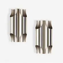 Sconces, pair by Maison Charles, c. 1970, chrome-plated stainless steel, sold May 2023