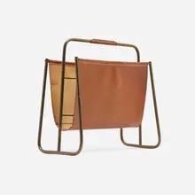 Magazine rack, model 4101 by Carl Auböck, c. 1950, brass, leather, sold May 2023