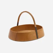 Nut bowl by Carl Auböck, 1944, wood, patinated brass, cane, sold May 2023