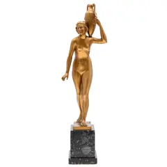 Art Deco FigureGilt by Otto Schmidt-Hofer, Bronze figure of a woman bearing a Classical urn.The figure on a marble plinth.s, offered Jun 2024