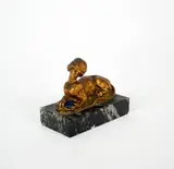 Sphinge by Georges Flamand, Epreuve en bronze à patine dorée et cabochon sur base en marbre vert-de-mer Signé au dos, sold Aug 2026