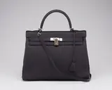 A BLACK TOGO LEATHER RETOURNÉ KELLY 35 WITH PALLADIUM HARDWARE by Hermès, A BLACK TOGO LEATHER RETOURNÉ KELLY 35 WITH PALLADIUM HARDWARE, sold Jan 2026