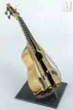 Ukulélé by Arman, Bronze et métal, sold Jul 2011