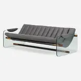 Sofa by Adrian Pearsall, c. 1965, vinyl, glass, enameled steel, walnut, sold May 2023