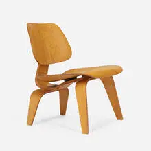 LCW by Charles and Ray Eames, molded ash plywood, rubber, sold May 2023