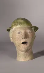 Tête au chapeau by Agnès Baillon, 2005, Epreuve en bronze à patine verte, rehaussée de couleurs, sold Dec 2025