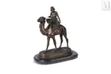 Mehariste by Emile Guillemin, Epreuve en bronze à double patine brune et dorée, sold Dec 2022