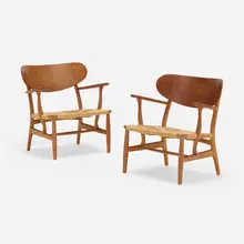 Lounge chairs model CH22, pair by Hans J. Wegner, 1951, oak, paper cord, sold May 2023