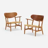 Lounge chairs model CH22, pair by Hans J. Wegner, 1951, oak, paper cord, sold May 2023