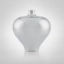 Urn by Karim Rashid, 2003, polished metal, sold May 2023
