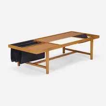 Coffee table by Milo Baughman, c. 1952, maple, laminate, canvas, sold May 2023