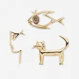 Collection of three brooches by Jean Cocteau, 1997-2001, gold-plated brass, enamel, sold May 2023