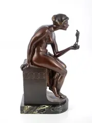 Untitled by Anton Grath, bronze of a lady holding a sculpture in her hand, sold Sep 2021