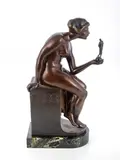 Untitled by Anton Grath, bronze of a lady holding a sculpture in her hand, sold Sep 2021