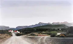 Extensive Cape Landscape with Country Road by Hannes Du Plessis, oil on canvas, sold Sep 2021