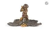 Encrier à décor d'un putto, de grappes de raisin et feuilles de vigne by Charles Cumberworth, Epreuve en bronze patiné et doré Signé, sold May 2026
