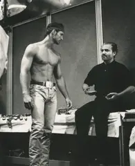 Portrait du styliste italien Gianni Versace en présence d’un mannequin, c. 1990 by Michael Roberts, Tirage argentique d’époque Photographie :, sold May 2026