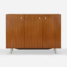 Thin Edge cabinet, model 5830 by George Nelson & Associates, walnut, enameled steel, matte chrome-plated steel, laminate, sold May 2023