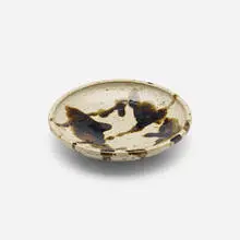 Dish by Shoji Hamada, c. 1955, glazed stoneware, sold May 2023