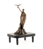 Victorie - 1980 by Romain de Tirtoff Erte, bronze sculpture accompanied by stand, sold Oct 2024