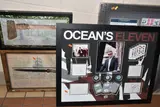 framed poker chips, playing cards, photographs and by Framed Memorabilia Including Ocean's Eleven, print, sold May 2026