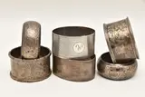 various designs, all with a full silver hallmark, three with engraved by Six Silver Napkin Rings, sculpture, sold Apr 2026