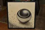 Relativity sphere by Craig Alan, mixed media on wood, sold Feb 2026