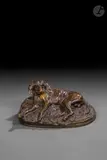 Chien de meute allongé by Emmanuel Frémiet, Epreuve en bronze à patine brun clair, sold Mar 2026
