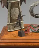Personnage sur une jambe by Michel Rico, Épreuve en bronze patiné et doré, sold Jun 2025