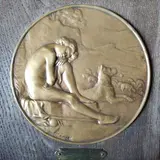 1929 Berger endormi by Julien Louis Mérot, Bronze signé, sur panneau de chêne Plaque inscrite "Prix marchadier d'Estray / En souvenir, sold Mar 2026