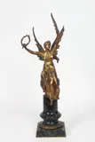 La Victoire assise sur un globe aux by Edouard Drouot, Epreuve en bronze a patine dorée Signée au dos sur le globe, sold May 2026