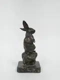 Lapin aux aguets by Prosper Lecourtier, Epreuve en bronze à patine brune signé à l'arrière, sur une terrasse en marbre, sold Apr 2026