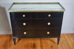 Commode. Black lacquer with gilded by Commode, bronze fittings and mirrored top. 20 3/8 D x 35 H x 42 1/2 W in. Four drawers. P, offered Oct 2020