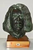 A BRONZED COMPOSITE BUST MOUNTED ON A WOODEN PLINTH with a textured bronzed finish, by Len Hardy, sculpture, sold Jun 2025