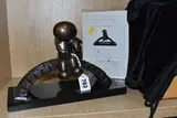 Watching the world go by by Doug Hyde, bronze, sold May 2025