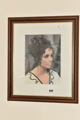 a signed and framed studio photograph of the legendary actress in her iconic by Elizabeth Taylor, photograph, sold May 2025