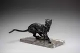 Running Leopard Signed and dated KENWORTHY 68 by Jonathan Kenworthy, Bronze, with dark black-brown patina, upon a rectangular grey and white marble base, offered Dec 2025