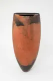 A tall vessel burnished and smoke fired in terracotta and black by Gabriele Koch, sculpture, sold Dec 2025