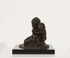 Cherub with Dog and Frog by Joseph d'Asté, bronze on marble plinth, sold Feb 2020