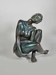 Nu assis by Marie-Paule Deville-Chabrolle, Epreuve en bronze à patine brun nuancé bleu, sold Dec 2024