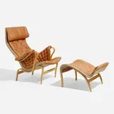 Pernilla 69 lounge chair and ottoman by Bruno Mathsson, 1969 / 1994, leather, beech plywood, canvas, sold Apr 2023