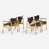Armchairs, set of four by Finn Juhl, c. 1970, walnut, maple, leather, sold Apr 2023