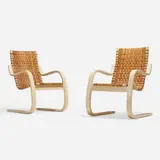 Cantilevered chairs model 406, pair by Alvar Aalto, lacquered birch plywood, cane, sold Apr 2023