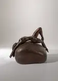 Women lying on a rock by Tom Merrifield, bronze, sold Mar 2026